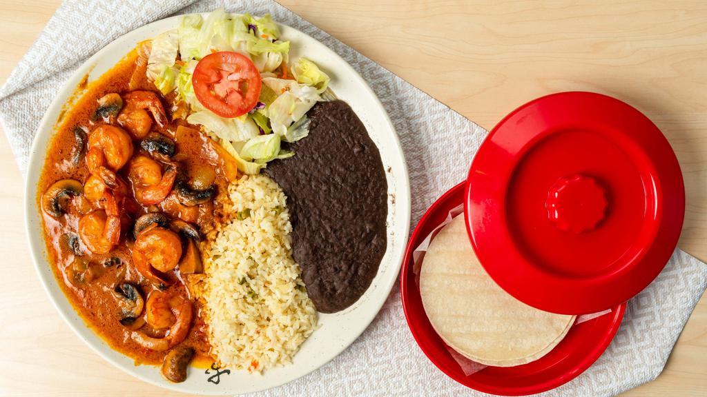 Camarones Al Mojo De Ajo · Sauteed prawns with mushrooms, onions and garlic sauce. Served with rice, beans, salad and your choice of tortillas.