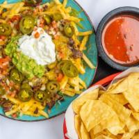 Tres Amigos Fries · French fries, beans, cheese, jalapeños, guacamole, sour cream and Pico de Gallo. Your choice...