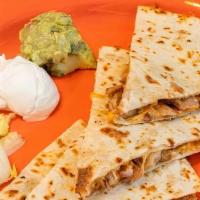 Tres Amigos Quesadilla · Twelve inches flour tortilla filled with cheese. Served with sour cream and guacamole. Your ...