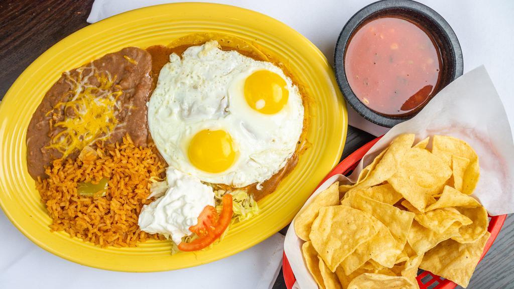 New Mexico Enchiladas · Cheese enchiladas stacked and topped with two eggs any style and sour cream. Served with rice and beans.
