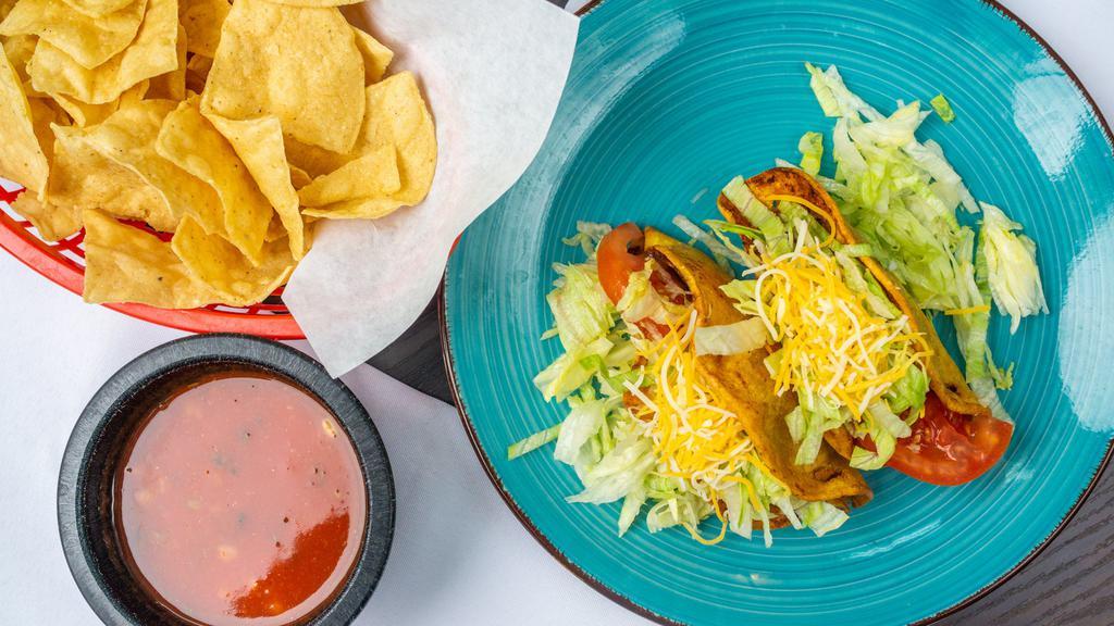 Hard Shell Tacos · Crispy corn tortilla filled with your choice of meat, lettuce, cheese, and tomatoes.