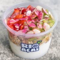Copacabana · Creamy coconut base topped with granola, strawberries, kiwi, sliced almonds, agave for a dri...