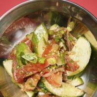Cucumber Salad · Cucumbers, tomatoes, red onion, scallions and cumin.