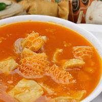 Menudo · Traditional Menudo soup served with onion, cilantro, lime, and your choice of tortillas (thr...