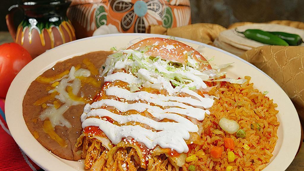 Enchilada Plate · Three enchiladas with your choice of filling, sour cream, lettuce, and tomato. Served with rice and beans. Choose up to three meats or filling.