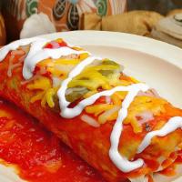 Wet Combo Burrito · Our burrito (your choice of meat, beans, rice, onion, and cilantro) drenched in salsa ranche...