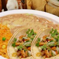 Taco Plate · Two tacos served with rice, beans, and your choice of meat.