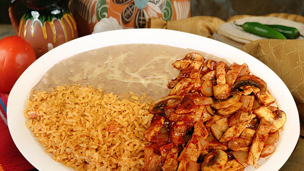 Pollo A La Diabla · Spicy. Grilled chicken in a spicy red sauce served with rice, beans, your choice of tortillas (three) and a side salad.