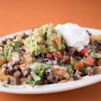 Asada Fries · Most popular. Served with you choice of meat, beans, cheese, pico de gallo sour cream and gu...