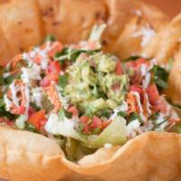 Taco Salad Bowl · Edible fried flour tortilla bowl, filled with your choice of meat, beans, lettuce, baby gree...
