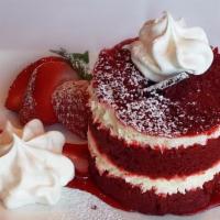 Decadent Red Velvet Cake · Red velvet cake layered with delicious cream cheese frosting topped with whipped cream
