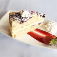 Layered Lemon Berry Cake · Sweet mascarpone iced cake with fresh berries