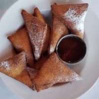 Sopapilla Basket · Fried pastry coated with cinnamon and sugar and served with a honey dipping sauce