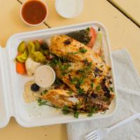 Fish Over Salad Platter · Grilled tilapia fillets drizzled with tahini sauce on top of salad. Pickled vegetables, tzat...
