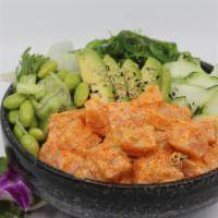 Spicy Salmon Poké Bowl · Choice of protein with rice base, pickled cucumber, avocado, edamame, green leaf lettuce and...