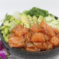 Poké Salmon Poké Bowl · Choice of protein with rice base, pickled cucumber, avocado, edamame, green leaf lettuce and...