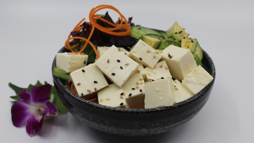Tofu (Vegetarian) Poke Bowl · Choice of protein with rice base, pickled cucumber, avocado, edamame, green leaf lettuce and seaweed salad.