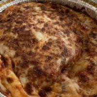 Lasagna · Beef lasagna with meat sauce, marinara, topped with mozzarella and oven baked.