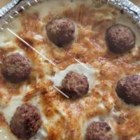 Baked Fettuccine Formaggi · Fettuccine with cheese, meatballs and house-made Alfredo sauce.