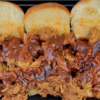 Pulled Pork Sliders · We start by slowly smoking our pork butt for 18 hours and then painstakingly  pulling it apa...