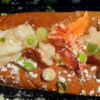 Lobster Roll · 1/4 lb. Fresh Maine Lobster flown in fresh daily, sautéed  in clarified gee butter placed on...