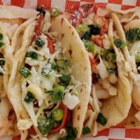 Crab Baja Taco · Four tacos on toasted flour tortillas with 1/4lb of fresh Alaskan king crab  sauteed in clar...