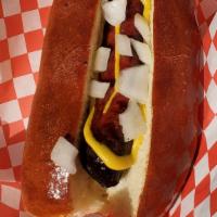 Brat · 1/4lb sausage beer brat smoked to perfection topped with French's mustard and sweet white on...