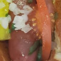 Chicago Dog · 1/4 pd All beef cafe hotdog cooked on a char grill to perfection, Placed on a toasted brioch...