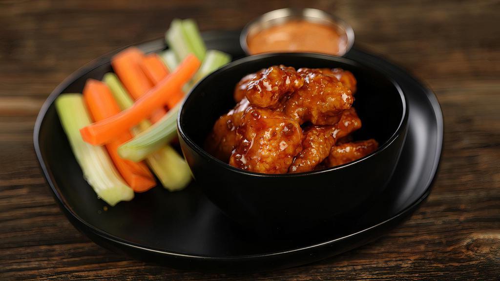 Boneless Korean Bbq · 8 boneless wings tossed in Korean BBQ (mild heat), served with carrots & celery and a dipping sauce of your choice.