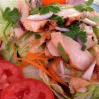 Lemongrass Chicken Salad · Grilled chicken with green lettuce, cucumber, tomatoes, onions, cilantro, and carrot in-hous...