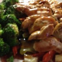Teriyaki Chicken · Grilled marinated chicken breast with broccoli, carrots, and cabbages topped with teriyaki s...