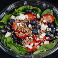 Strawberry Ecstasy Salad · Fresh Spinach topped with feta cheese, strawberries, blueberries, and sunflower seeds. Serve...