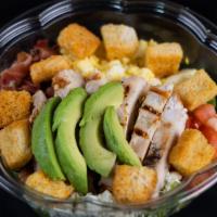 Cobb Salad · Classic American Cobb salad composed with mixed lettuce greens, bacon, eggs, tomatoes, bleu ...