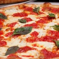 Margarita Pizza · Roma tomatoes, fresh garlic, olive oil, mozzarella cheese, basil, and pizza sauce.