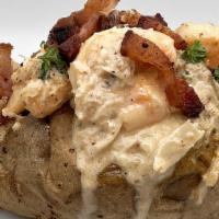 Cajun Pot · Oversized and overstuffed fluffy potato loaded with seasoned shrimp and crab meat covered in...
