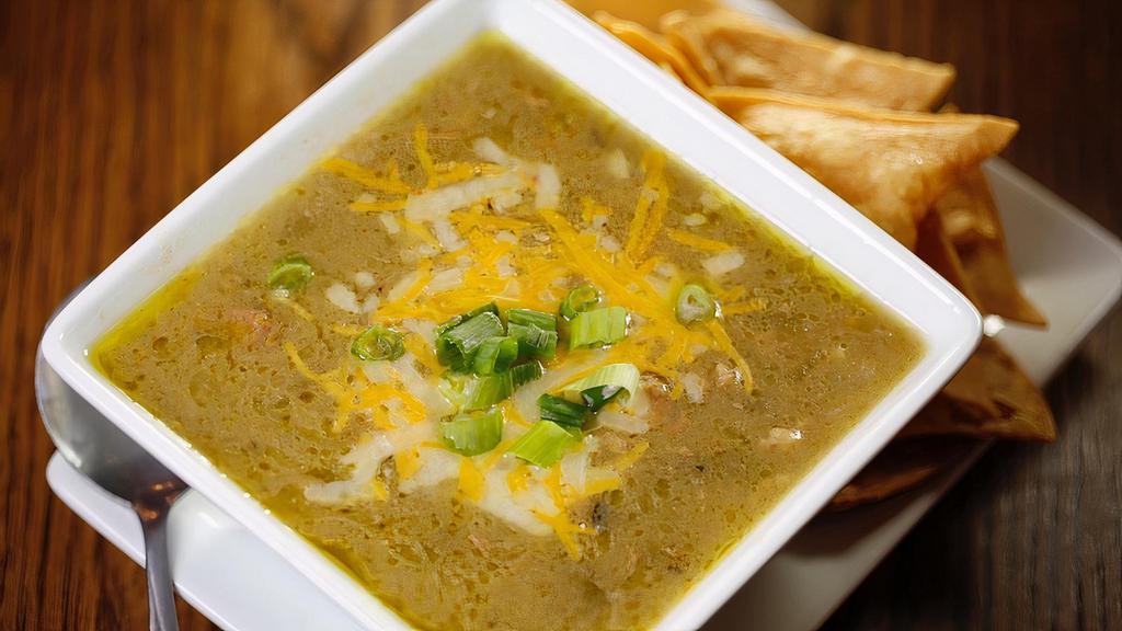 Pork Green Chile Cup · Thickened with masa & loaded with roasted hatch green chiles. Served with flour tortilla and chips.