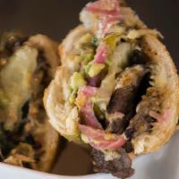 Carne Asada & Pepper Jack Torta · Black bean puree, pickled red onions, guacamole, pickles, roasted poblano peppers, chipotlec...