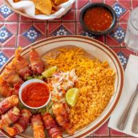 Camarones Vallarta · Deep fried shrimp wrapped in bacon, served with rice and beans.