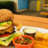 Mapache Burger And Yuca Fries · Beef patty, american cheese, seared ham, avocado, chicharron, fried egg, lettuce, tomato, on...