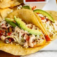 Philly Fish Tacos · Two beer-battered fish tacos on flour or corn tortillas with smoky chipotle mayo, shredded c...