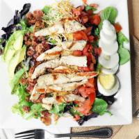 Chicken Cobb Salad · Fresh greens With choice of grilled or fried chicken, diced tomatoes, crisp bacon, twin chee...