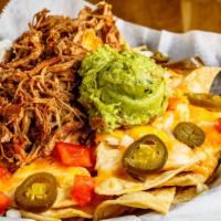 Green Chili Pork Nachos · Slow, tender-roasted, green chili with or without  pulled pork on top of tri-colored tortill...