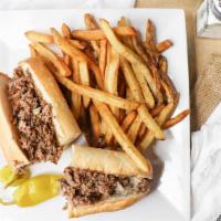 Traditional Philly · Shaved premium beef grilled with white american cheese.  Served on Amoroso roll