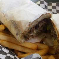 Philly Cheesesteak · 100% sliced rib-eye steak with onions and peppers, topped with monterrey jack and cheddar ch...