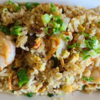 House Fried Rice · fried rice with chicken, beef, shrimp, eggs, green onions and carrots.