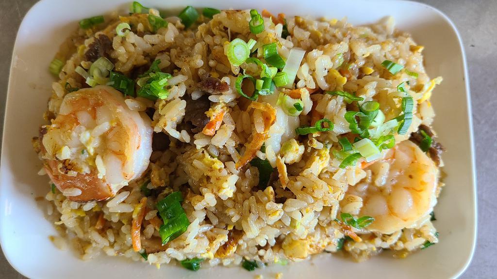 House Fried Rice · fried rice with chicken, beef, shrimp, eggs, green onions and carrots.