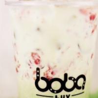 Strawberry Matcha · Matcha milktea topped off with fresh strawberry that is dice up.