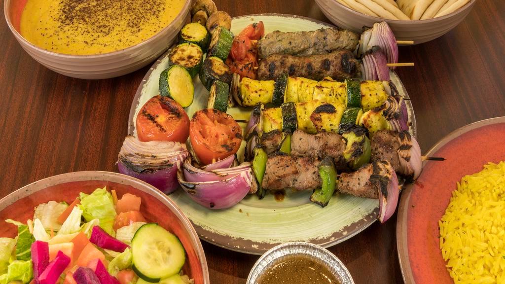 Kabob Platter Family Meal · Get 8 meat and/or veggie kabobs with an 8 oz sauce of your choice, a large house rice, a large Greek or Garden salad, 2 rounds of pita and 1 large side of your choice.