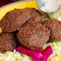 Falafels · Perfect blend of ground garbanzo beans, herbs, and seasoning balled and deep fried to perfec...
