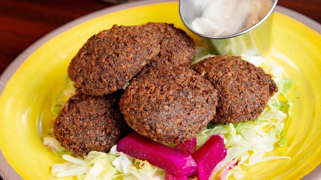 Falafels · Perfect blend of ground garbanzo beans, herbs, and seasoning balled and deep fried to perfection. Served with your choice of sauce. Comes with 5.